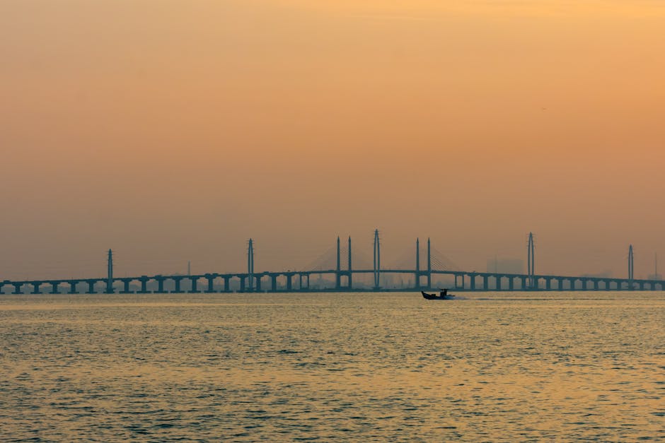 Penang Bridge aerial view cars driving sunset Malaysia