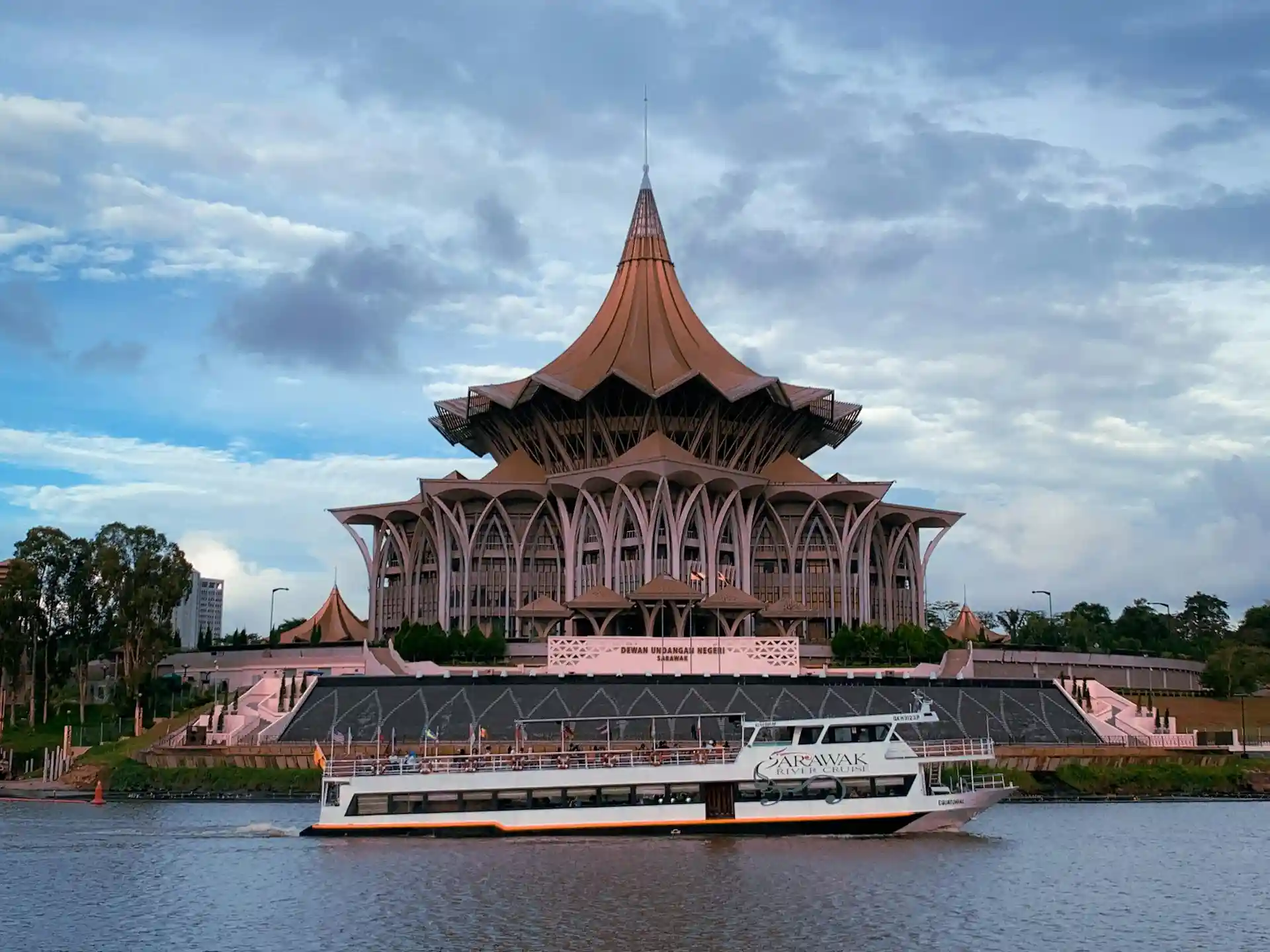 Kuching Waterfront with traditional boats and colonial buildings