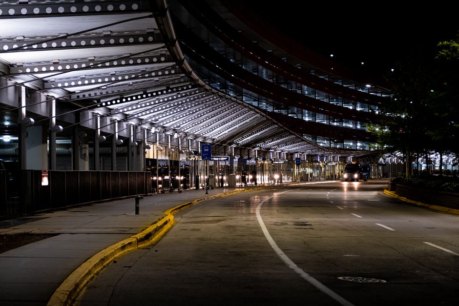 empty airport arrivals curb at night with taxis and cars waiting Malaysia