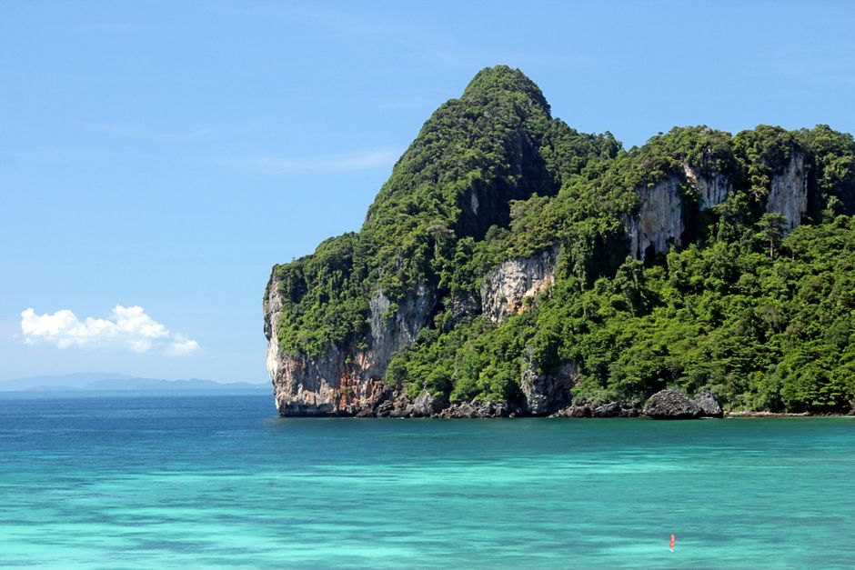 Krabi limestone karst cliffs dramatic aerial view Ao Nang bay turquoise water Thailand