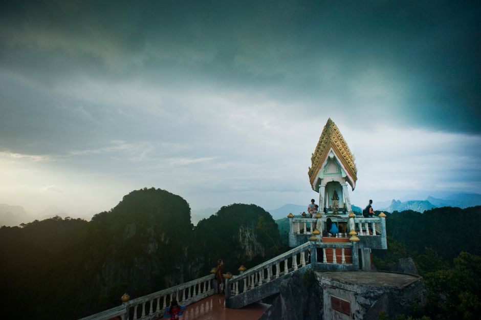 Tiger Cave Temple Wat Tham Seua summit shrine limestone karst mountain backdrop Krabi Thailand