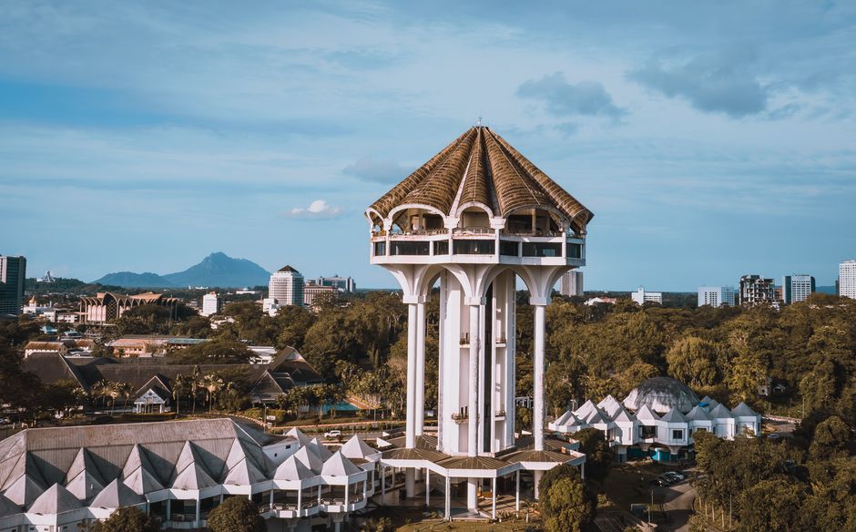 Kuching city centre heritage shophouses Carpenter Street morning golden light Sarawak Malaysia