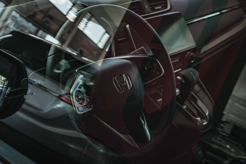 Honda City rental Malaysia highway driving modern sedan interior dashboard