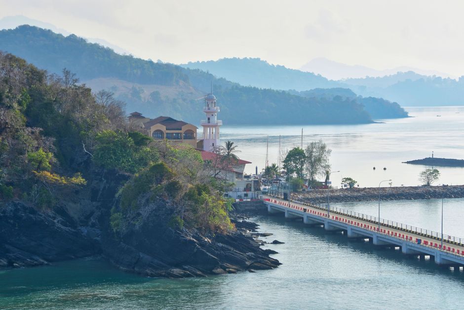 Langkawi island road tropical palm trees sedan rental car Malaysia scenic drive